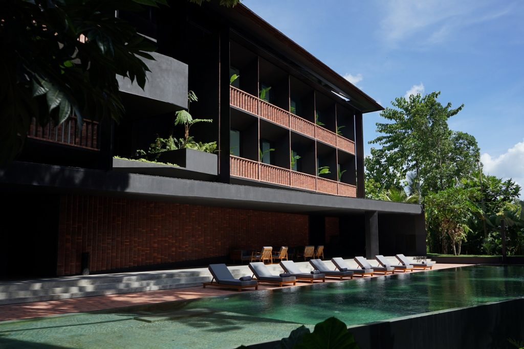 Titik Dua hotel in Ubud, Bali — modern balconies and a calm pool lined with loungers