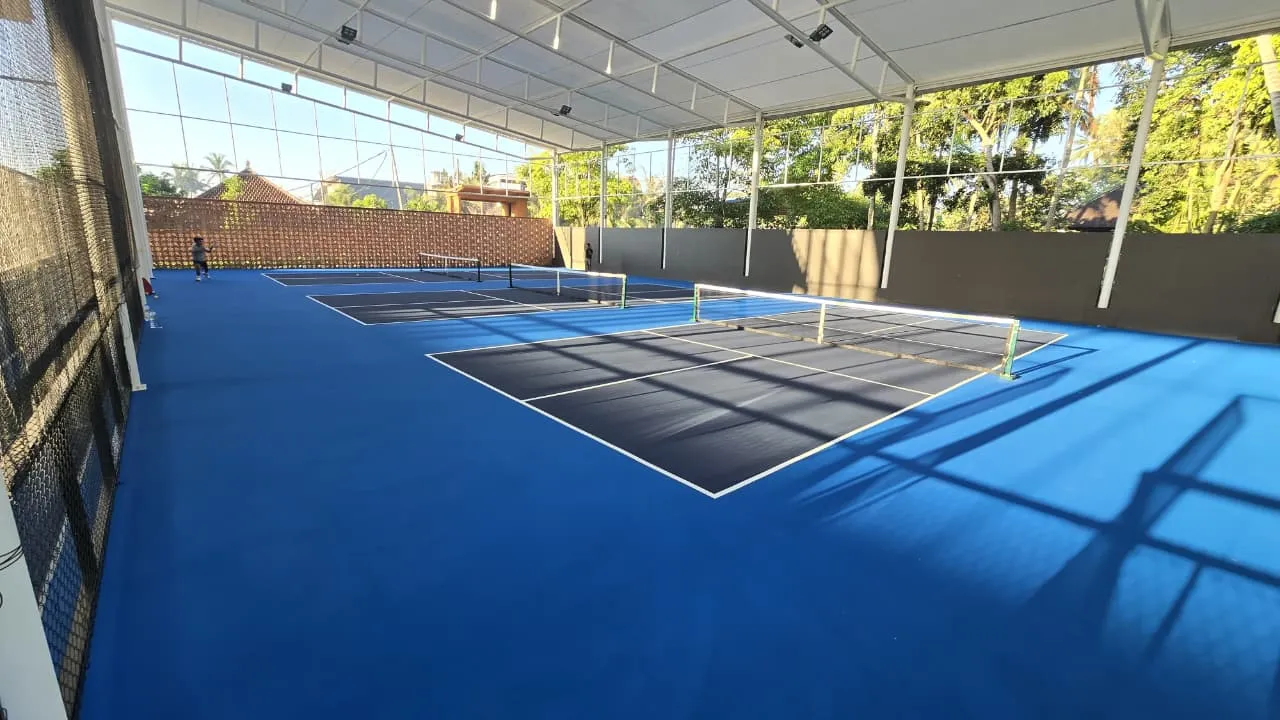 Indoor pickleball courts at Kula Mani tennis village in Ubud, Bali